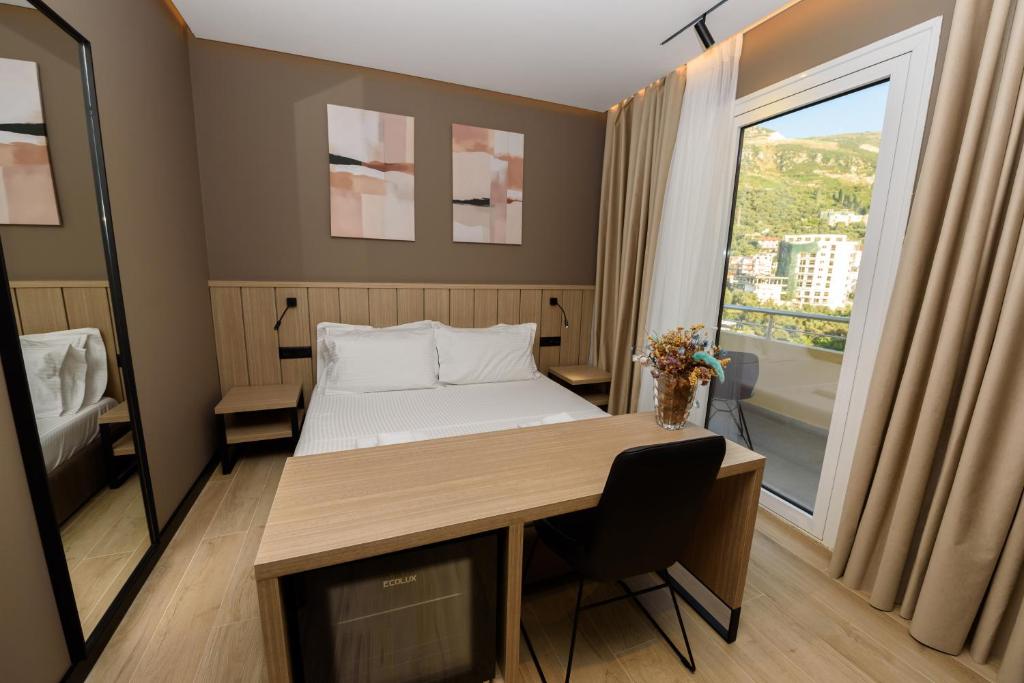 Postel nebo postele na pokoji v ubytování Vlora Suits You