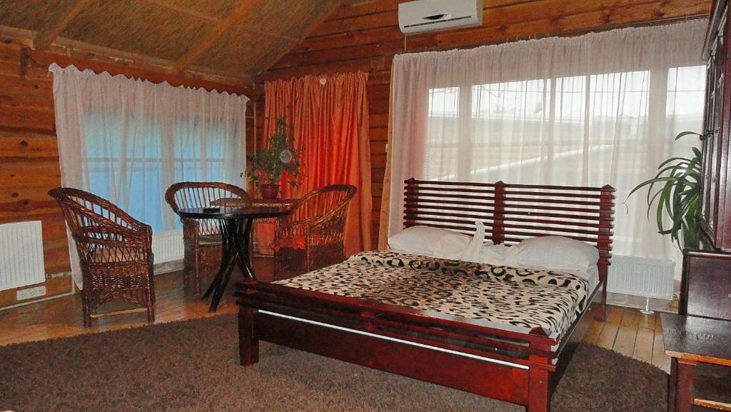 Postel nebo postele na pokoji v ubytování Kitech Guest House