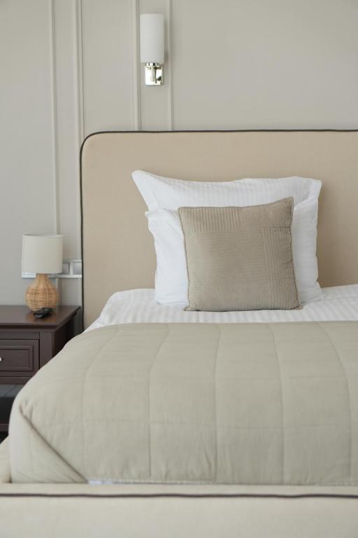 Postel nebo postele na pokoji v ubytování Boutique Hotel Portofino
