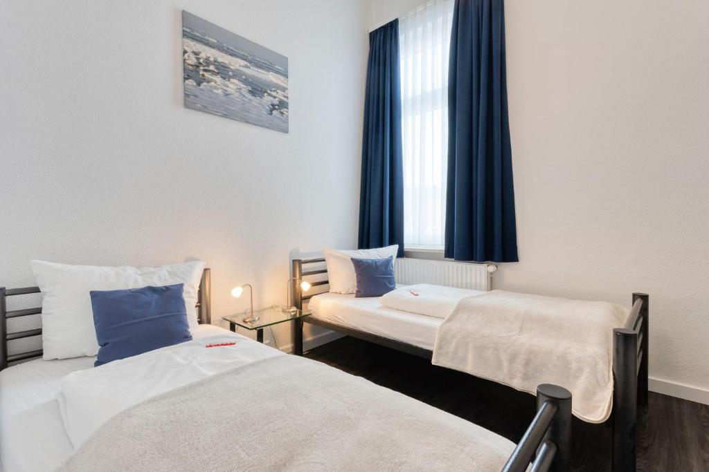 Postel nebo postele na pokoji v ubytování Buten un Binnen