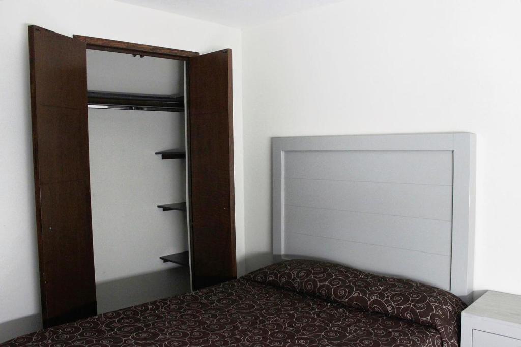 Postel nebo postele na pokoji v ubytování Hotel Colon Express
