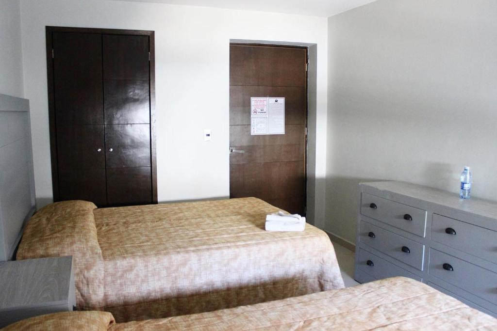Postel nebo postele na pokoji v ubytování Hotel Colon Express