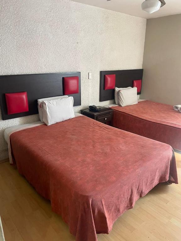 Postel nebo postele na pokoji v ubytování Hotel Colon Express