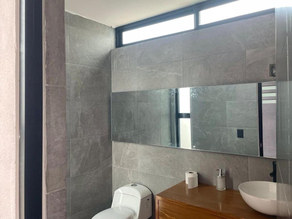 a bathroom with a sink and a mirror at Casa de Campo Morelia-Pátzcuaro in Morelia