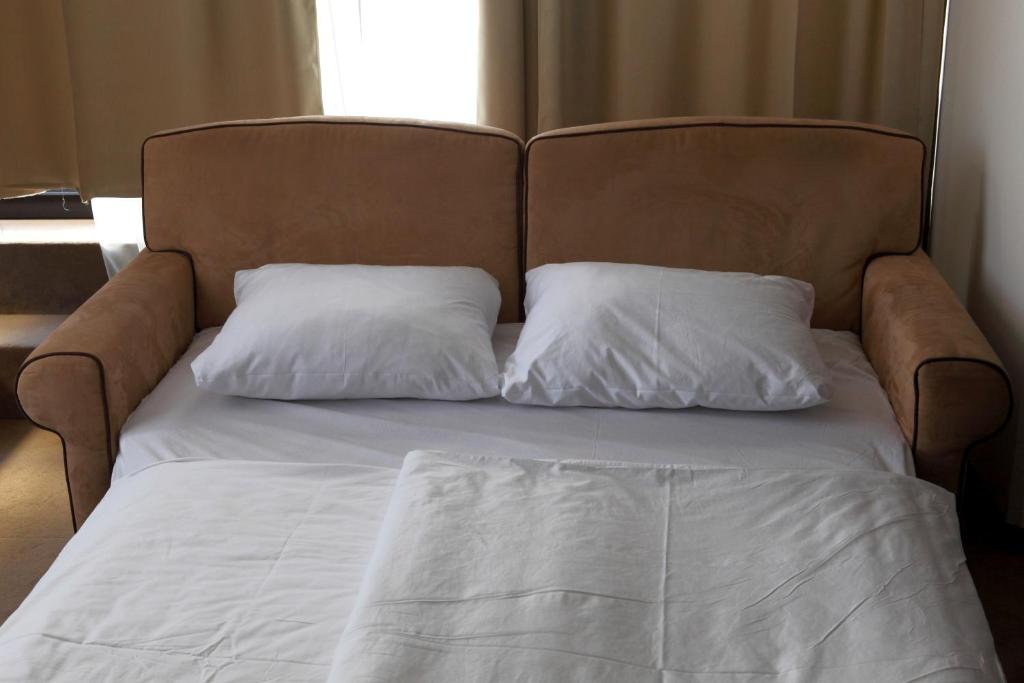Voodi või voodid majutusasutuse Hotel Kras toas