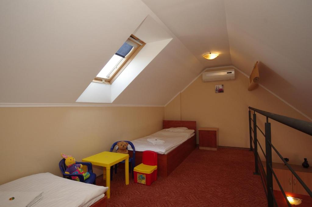Posteľ alebo postele v izbe v ubytovaní Gyulai Brill Apartman