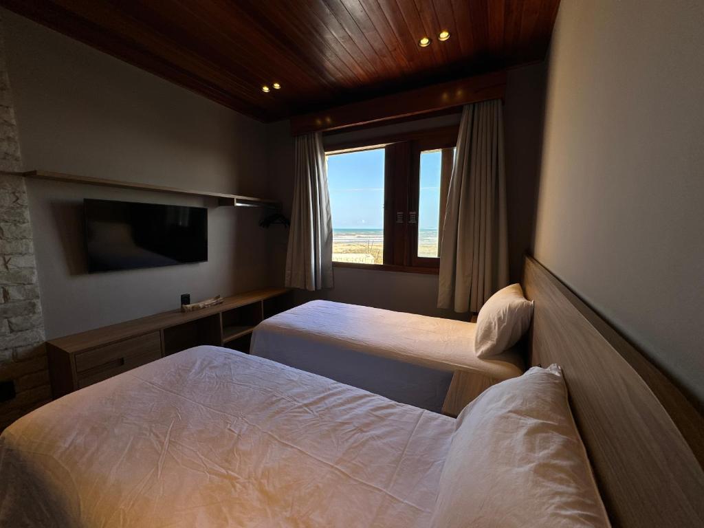 Postel nebo postele na pokoji v ubytování Villa Prime Beach Flats