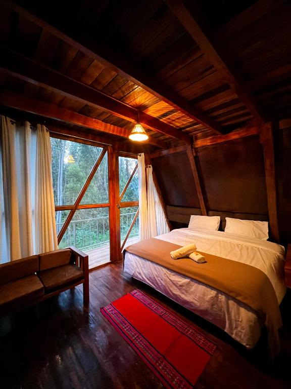 Postel nebo postele na pokoji v ubytování Samana Lodge