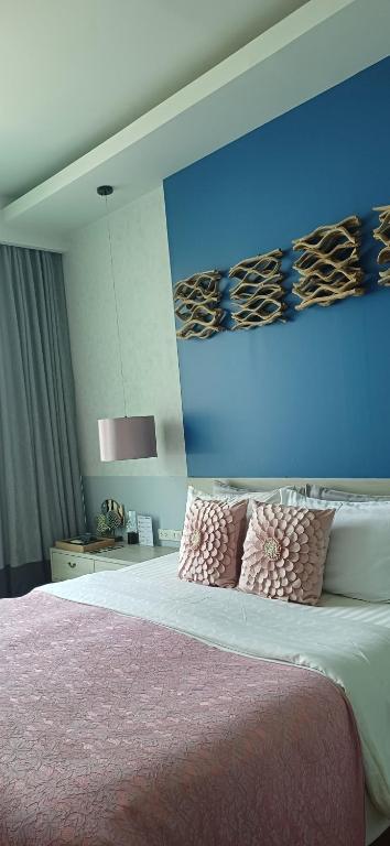 Postel nebo postele na pokoji v ubytování Mukrada House Boutique Hometel Krabi