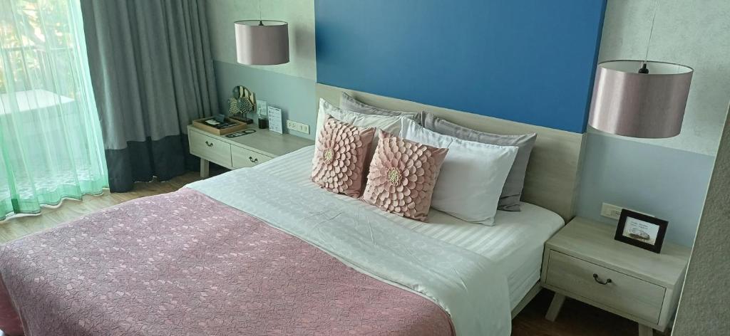 Postel nebo postele na pokoji v ubytování Mukrada House Boutique Hometel Krabi