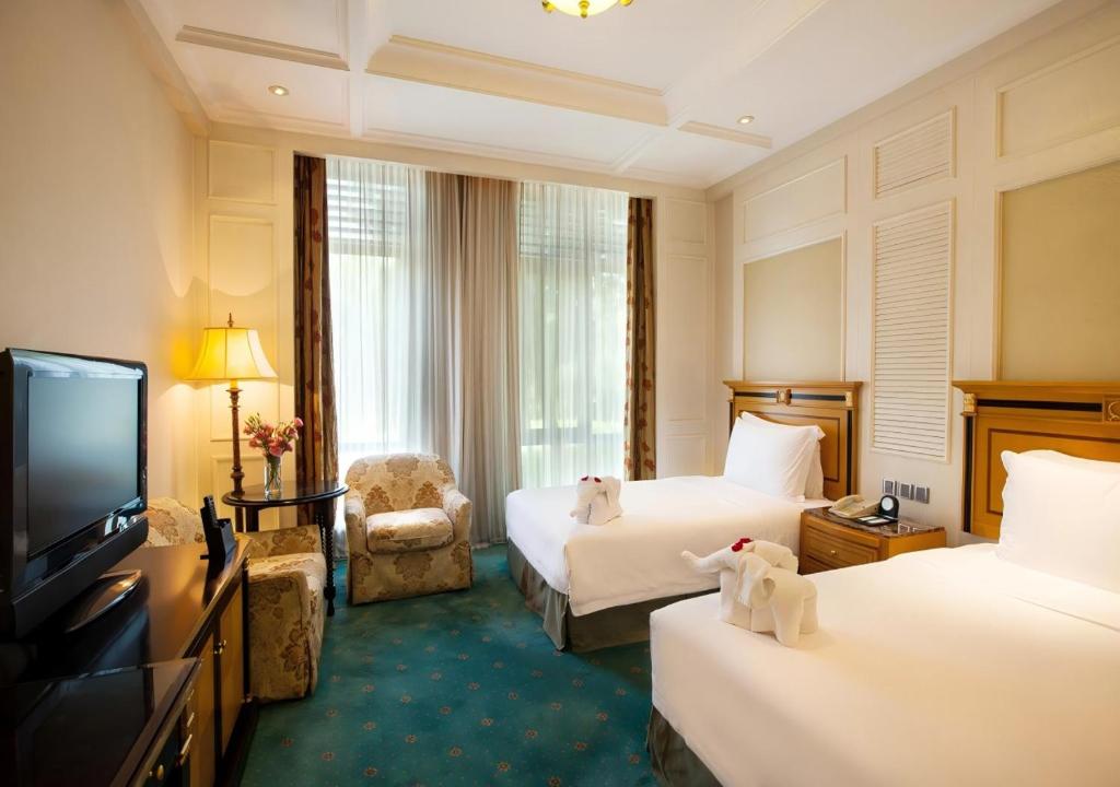 Postel nebo postele na pokoji v ubytování Seaview Resort Xiamen