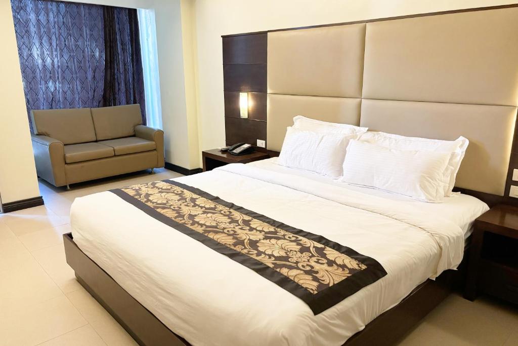 Uma cama ou camas num quarto em The Muse Hotel Boracay