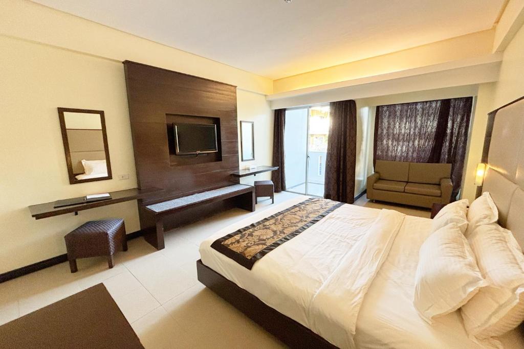 Uma cama ou camas num quarto em The Muse Hotel Boracay