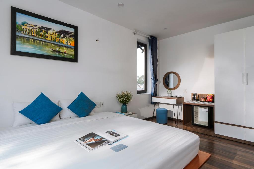 Giường trong phòng chung tại Sunora Villa Hoi An