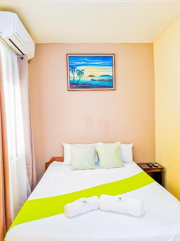 Postel nebo postele na pokoji v ubytování Cabinas Coco Alegre