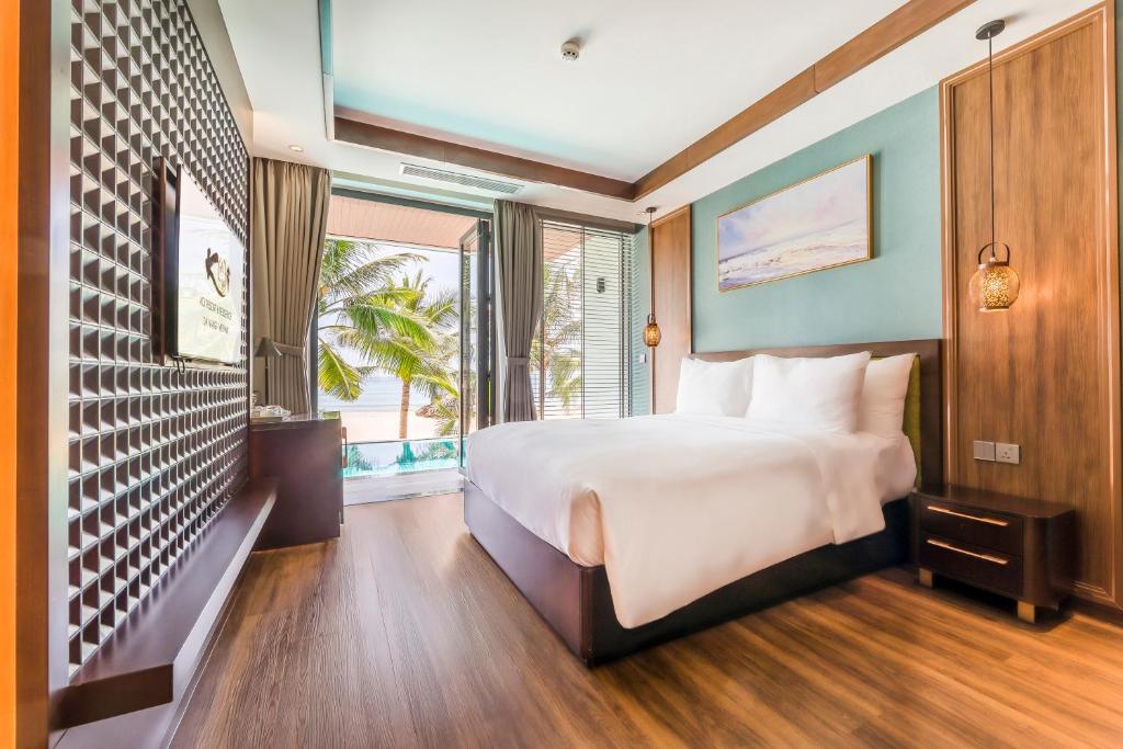 Postel nebo postele na pokoji v ubytování KOI Resort & Residence Da Nang