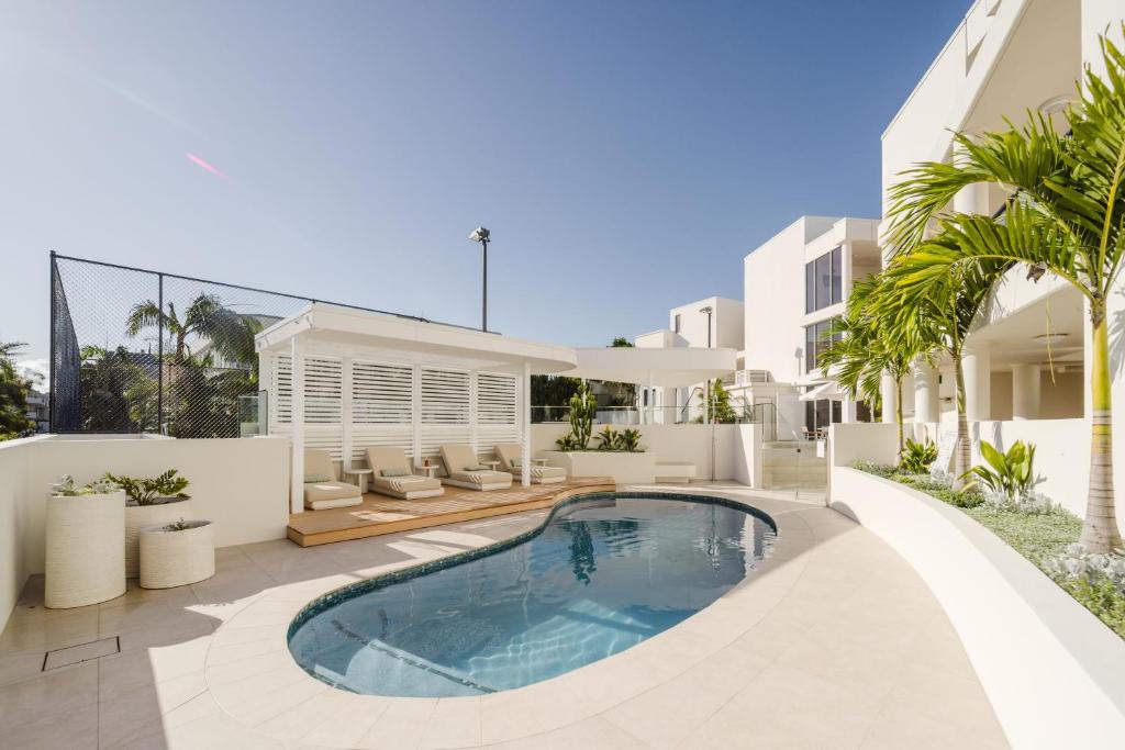 an image of a villa with a swimming pool at Bay Royal Apartments in Byron Bay