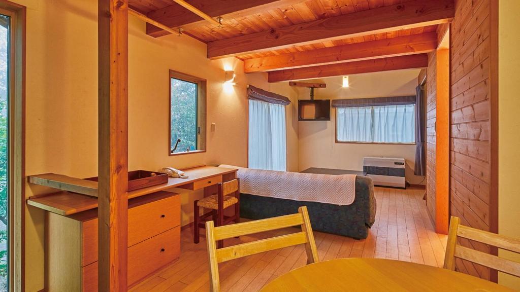 Postel nebo postele na pokoji v ubytování Tengu Onsen Asama Sanso