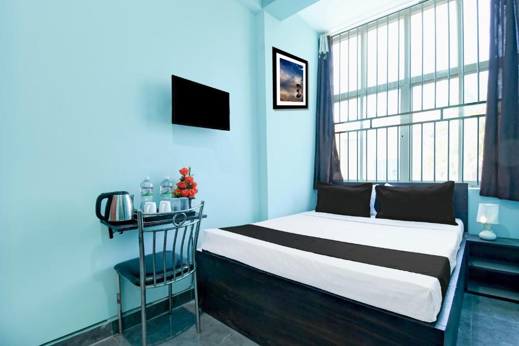 Postel nebo postele na pokoji v ubytování Hotel O Bhubaneshwar Near ITER College