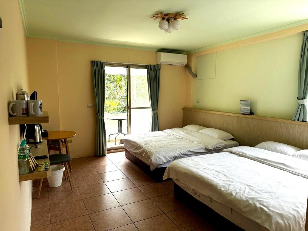Postel nebo postele na pokoji v ubytování Wan Lake Coffee Villa