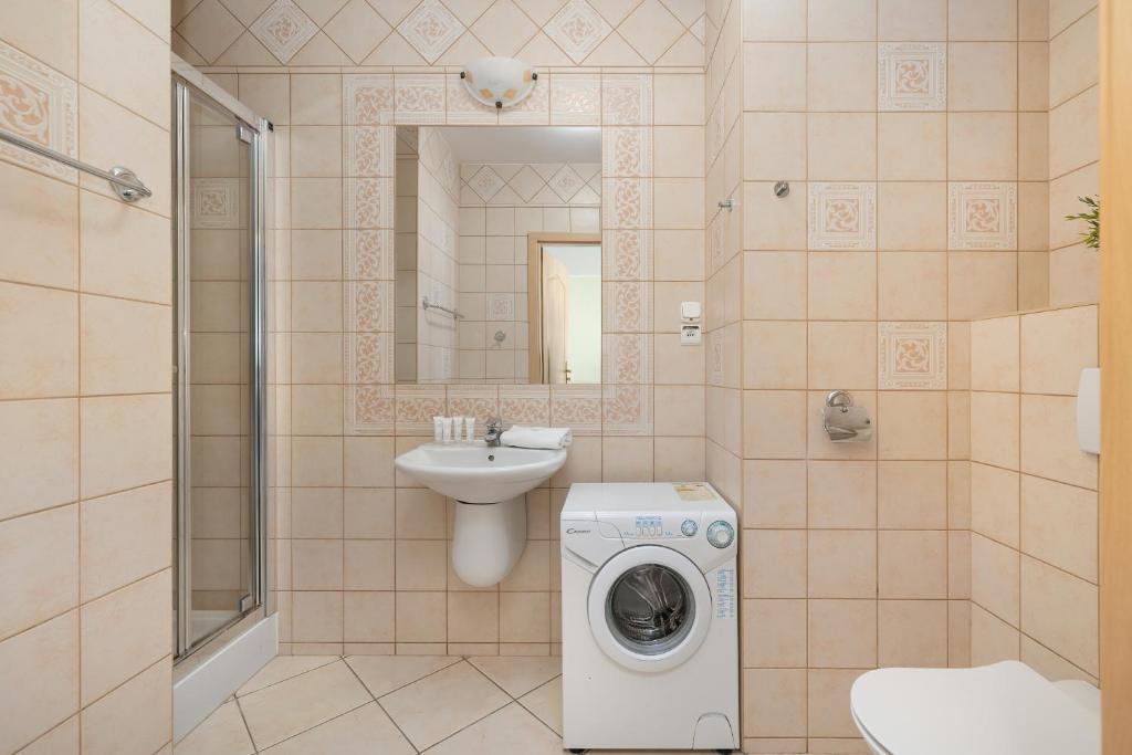 Koupelna v ubytování Jasny i Delikatny Apartament Sun Seasons 24 w Kołobrzegu by Noclegi Renters