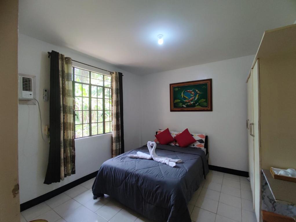 Postel nebo postele na pokoji v ubytování Antonio Homestay