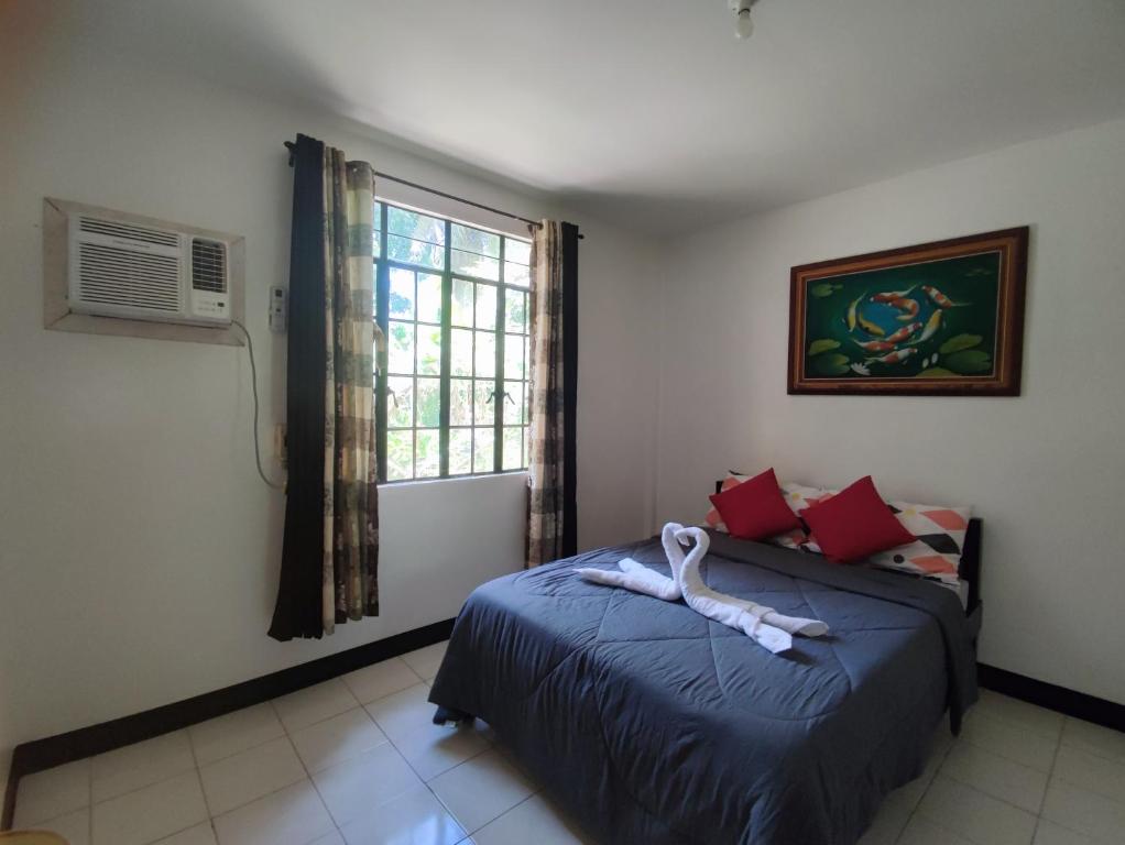 Postel nebo postele na pokoji v ubytování Antonio Homestay