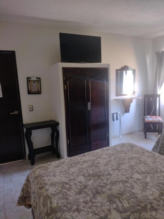Postel nebo postele na pokoji v ubytování Hotel El Refugio