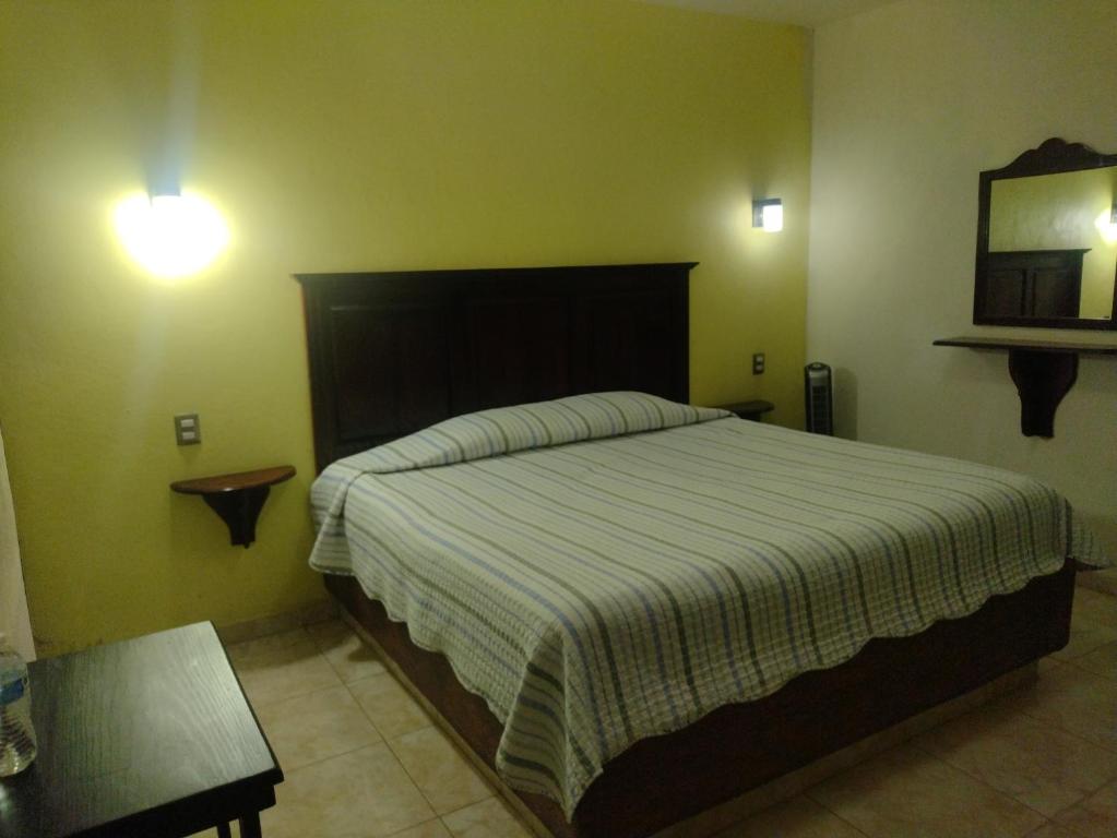 Postel nebo postele na pokoji v ubytování Hotel El Refugio