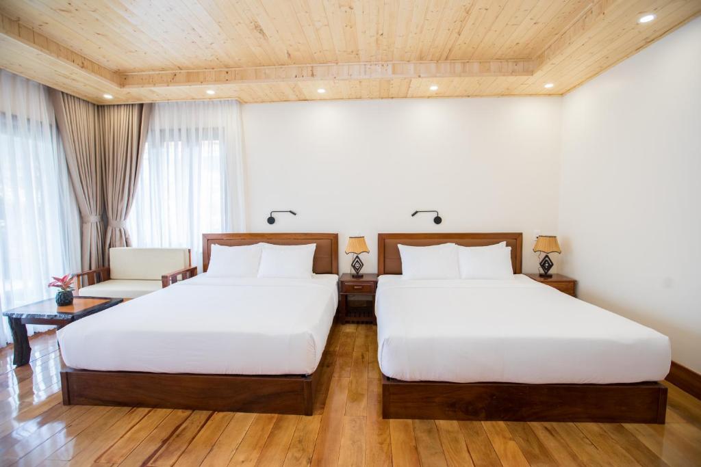 Postel nebo postele na pokoji v ubytování Phi Yen Eco Resort Can Tho