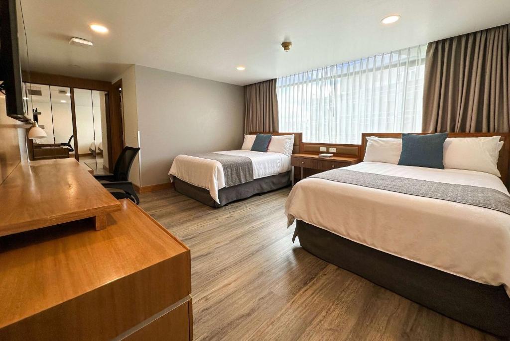 Postel nebo postele na pokoji v ubytování Wyndham Garden Quito