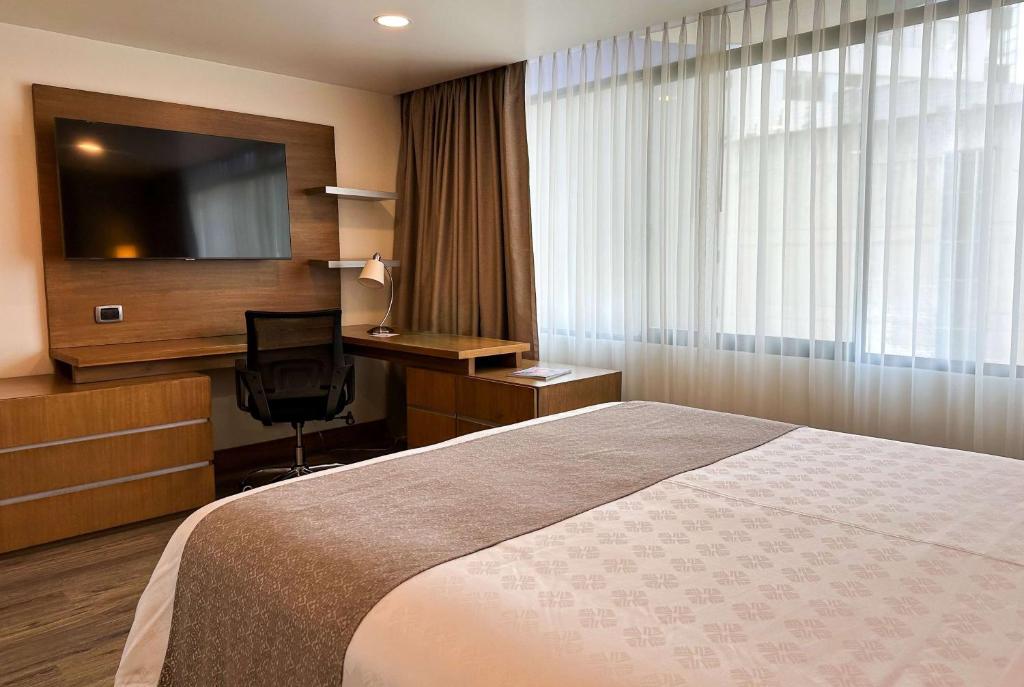 Postel nebo postele na pokoji v ubytování Wyndham Garden Quito
