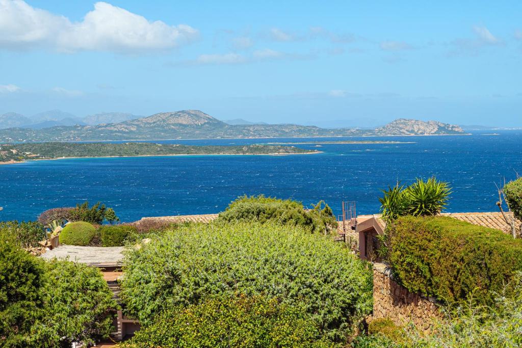 a view of the ocean from a house at Villa Caterina con depandance in Punta Molara