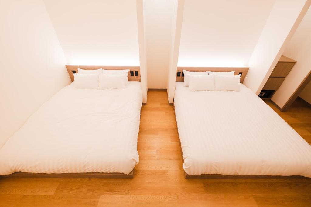 Ένα ή περισσότερα κρεβάτια σε δωμάτιο στο HOTEL ALL IN Kumamoto