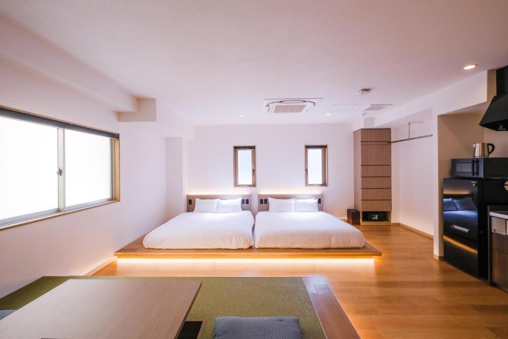 Ένα ή περισσότερα κρεβάτια σε δωμάτιο στο HOTEL ALL IN Kumamoto