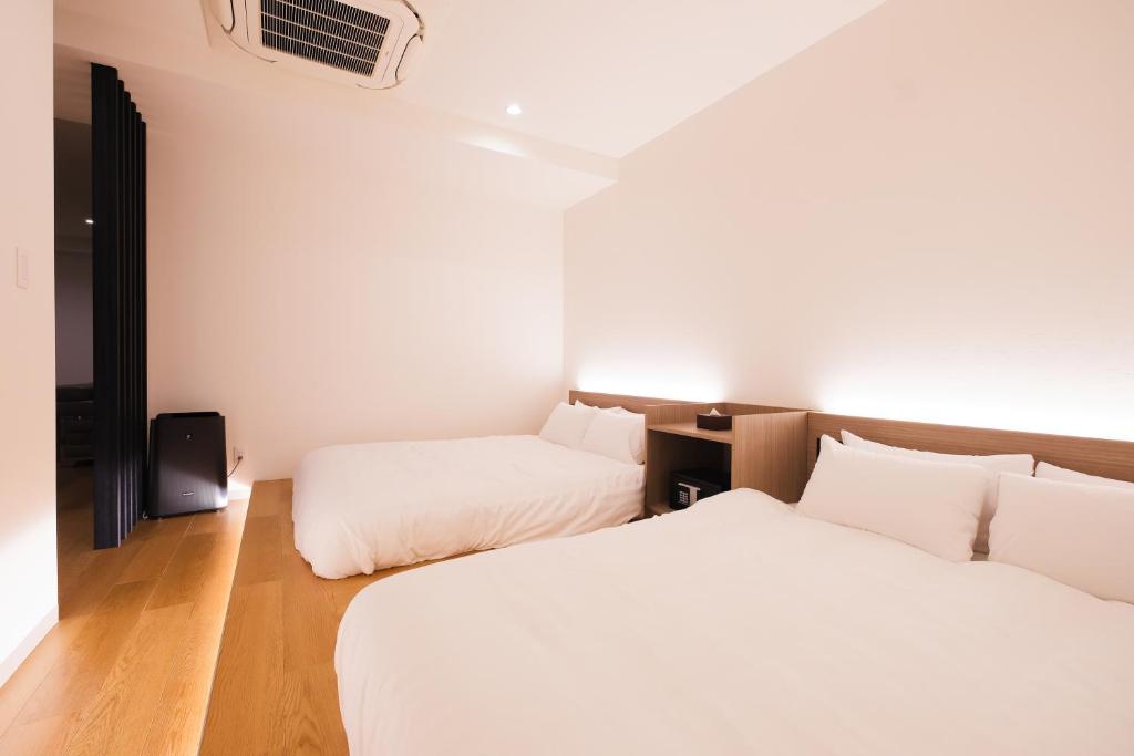 Ένα ή περισσότερα κρεβάτια σε δωμάτιο στο HOTEL ALL IN Kumamoto