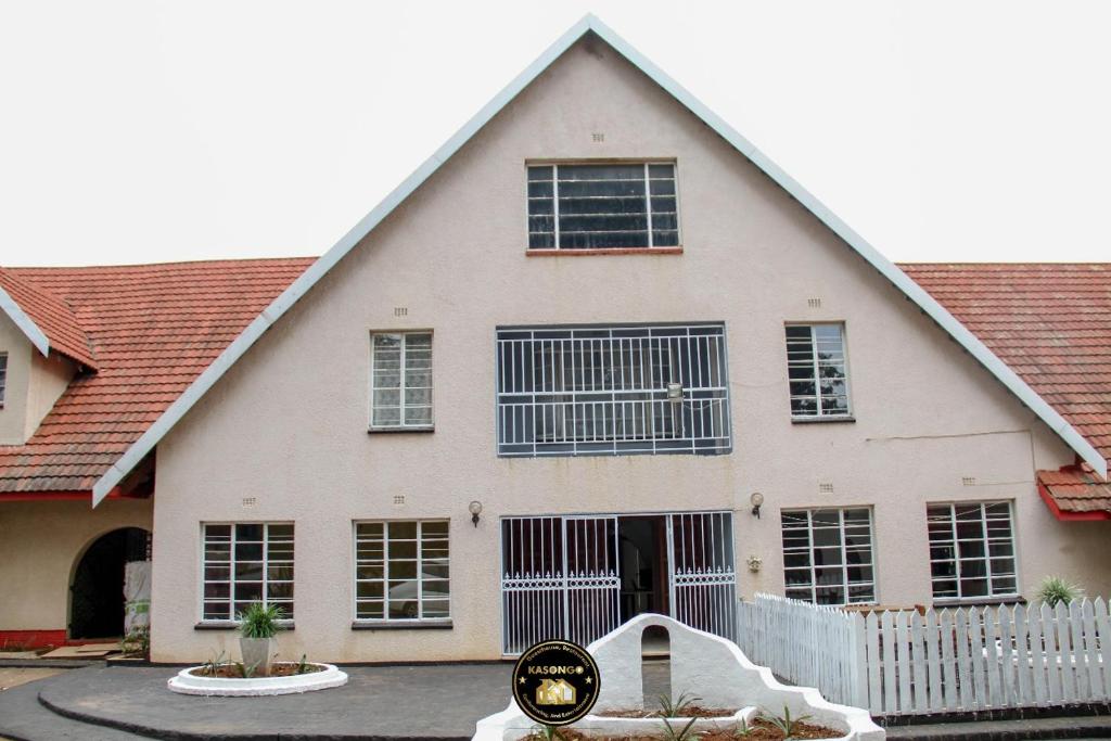 a house with a clock in front of it at KSG GuestFarm in Eikenhof