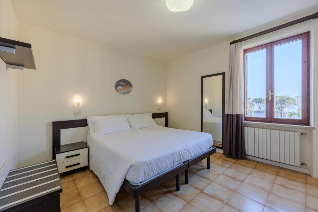 Postel nebo postele na pokoji v ubytování Hotel Alla Torre