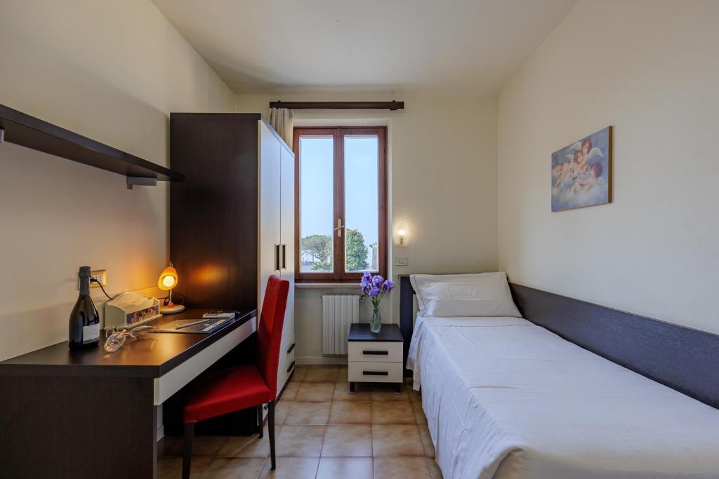 Postel nebo postele na pokoji v ubytování Hotel Alla Torre
