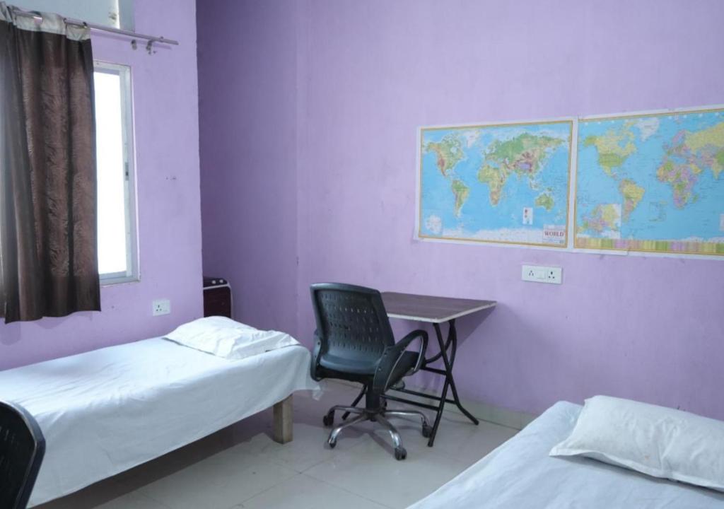Postel nebo postele na pokoji v ubytování riru girls hostel