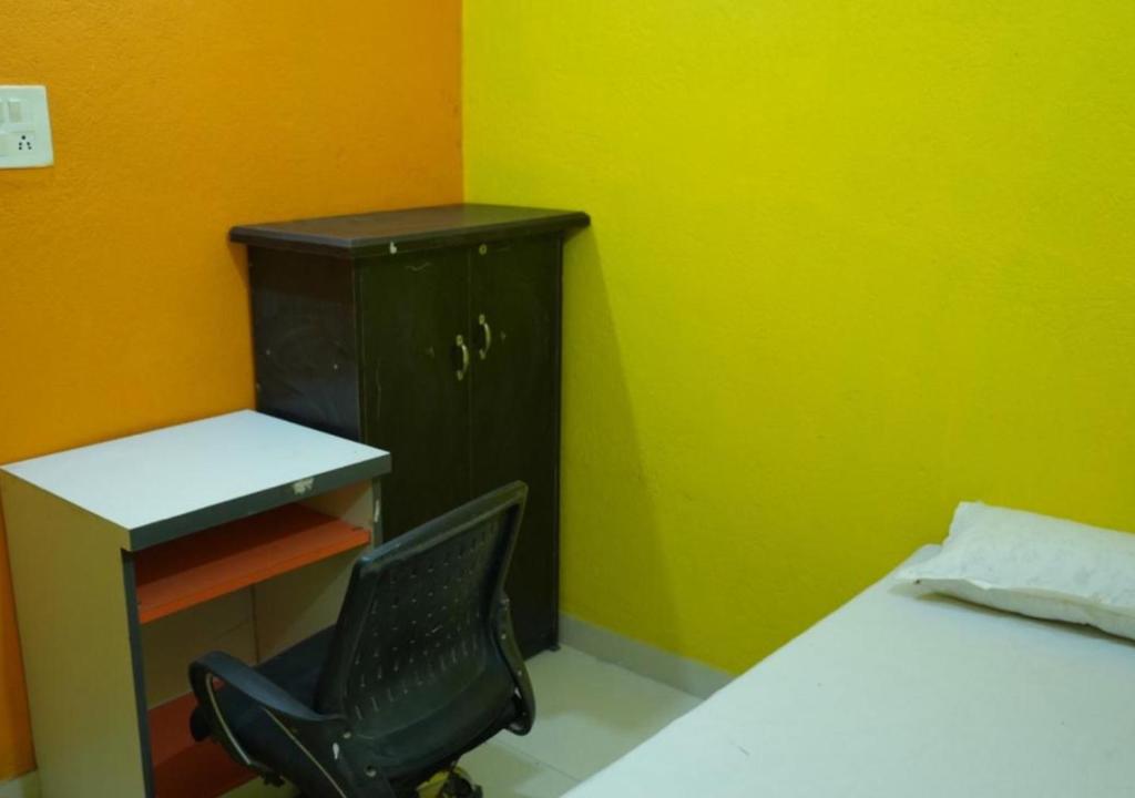 Postel nebo postele na pokoji v ubytování riru girls hostel