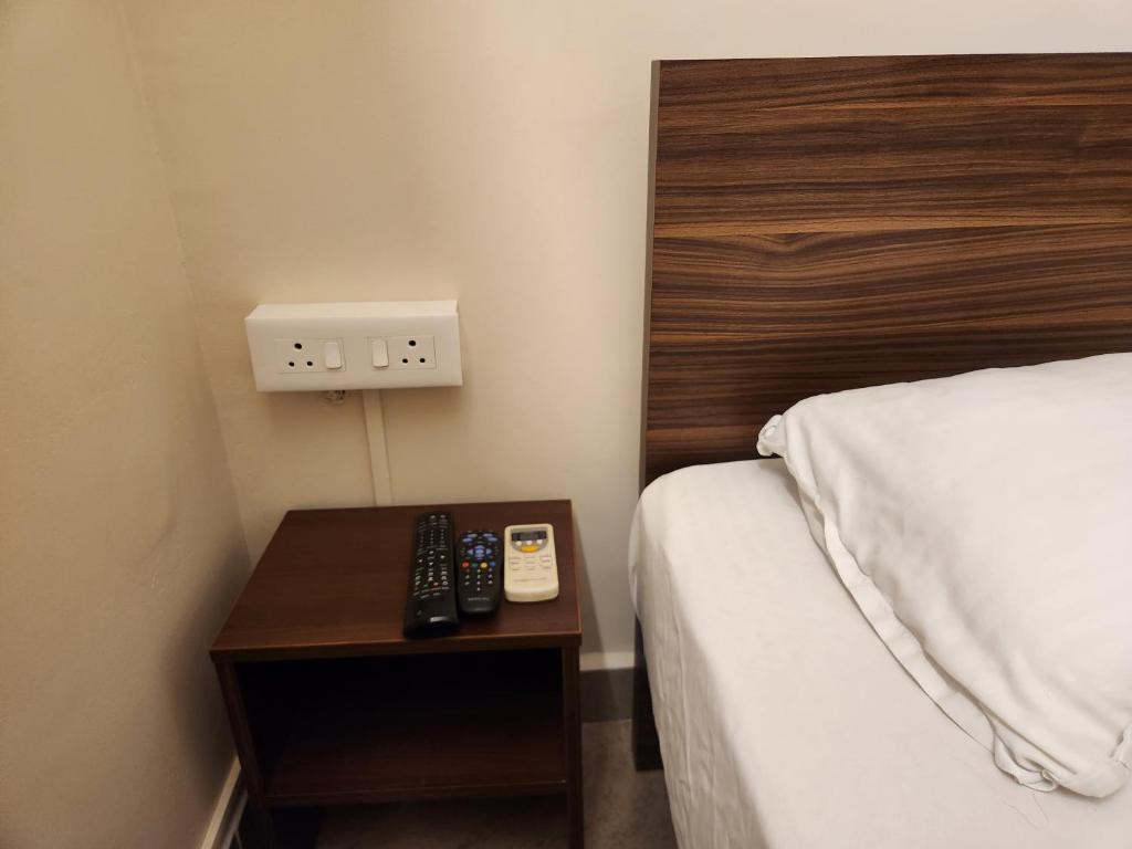 Postel nebo postele na pokoji v ubytování Sai Sharad Guest House