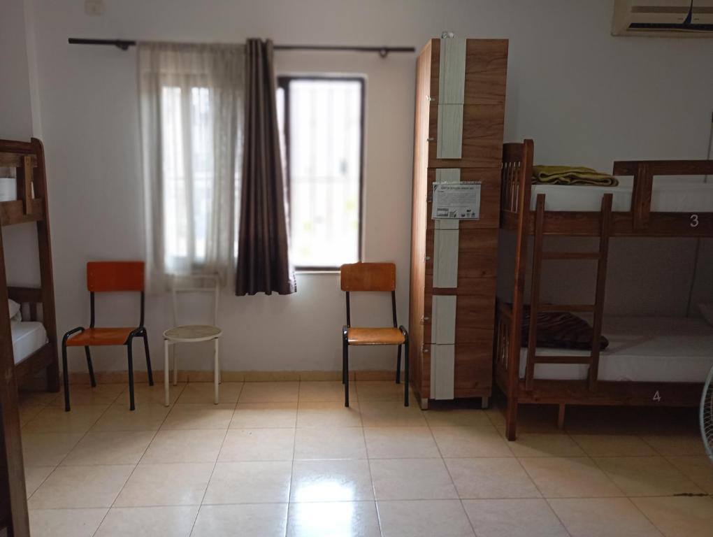 Postel nebo postele na pokoji v ubytování Blue Diamond HOSTEL Him Kolli STREET BUILDING NO 4
