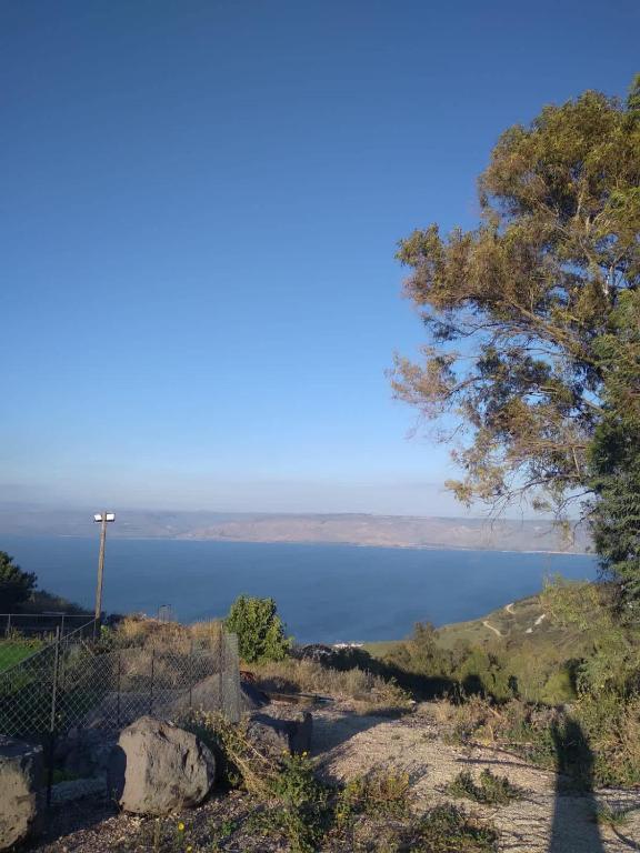 a view of a large body of water at Hofesh Yehonatan Hadas Garden Apt in Tiberias