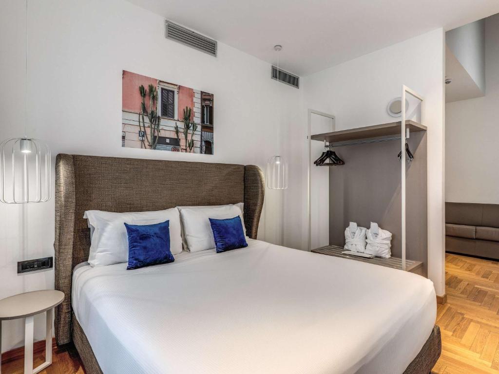 Postel nebo postele na pokoji v ubytování Mercure Roma Centro Termini