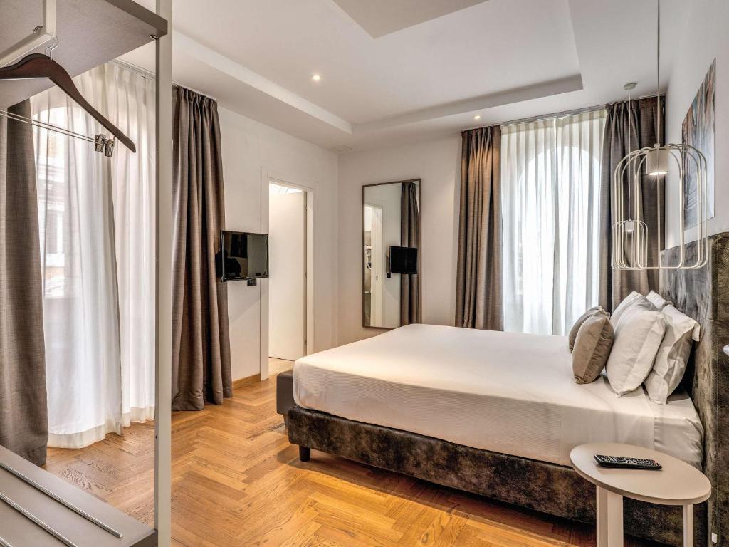 Postel nebo postele na pokoji v ubytování Mercure Roma Centro Termini