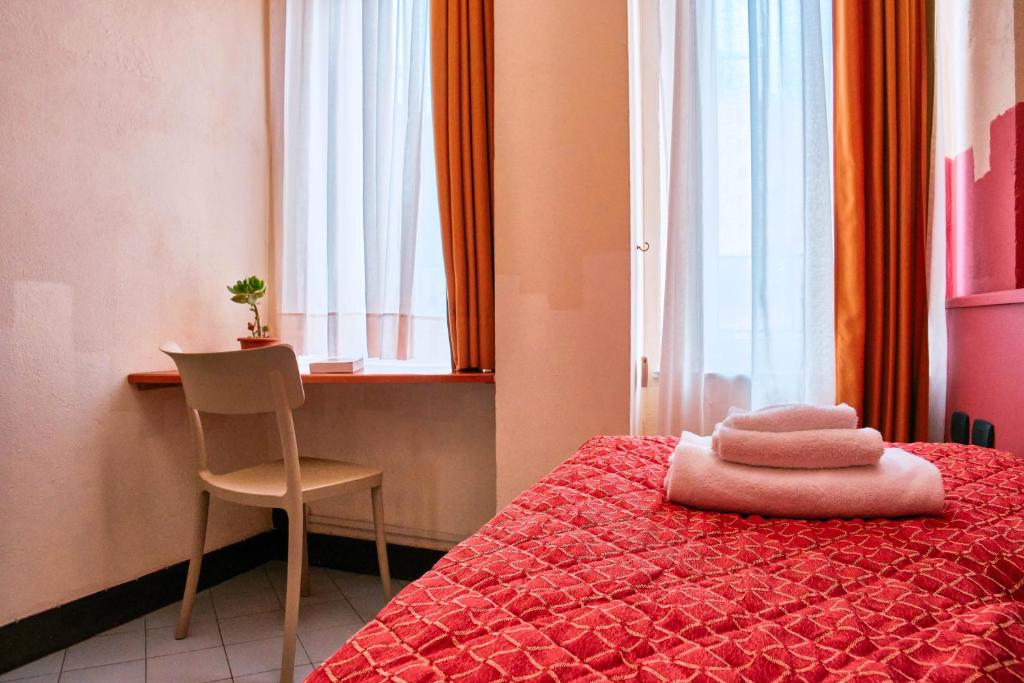 Letto o letti in una camera di Hotel Bello by Ostello Bello