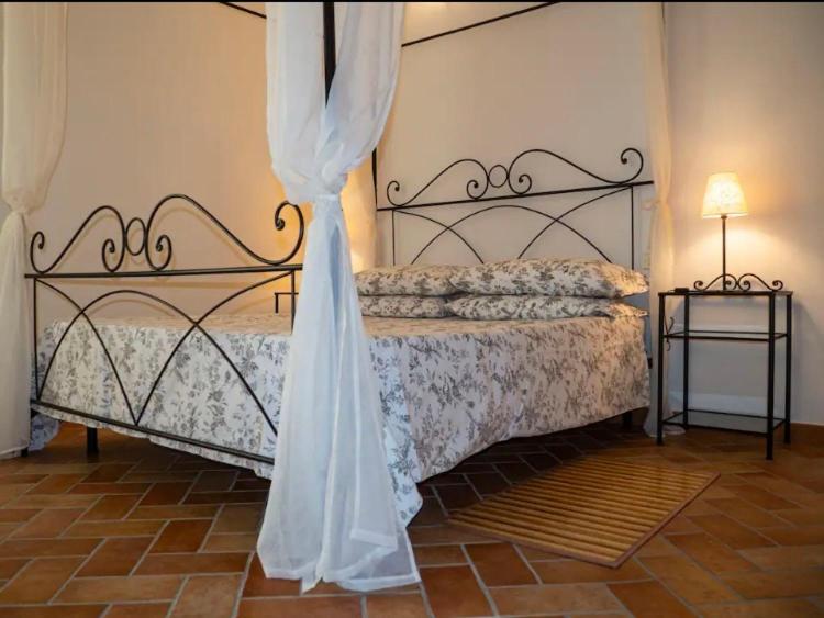 Postel nebo postele na pokoji v ubytování Agriturismo Podere Forano