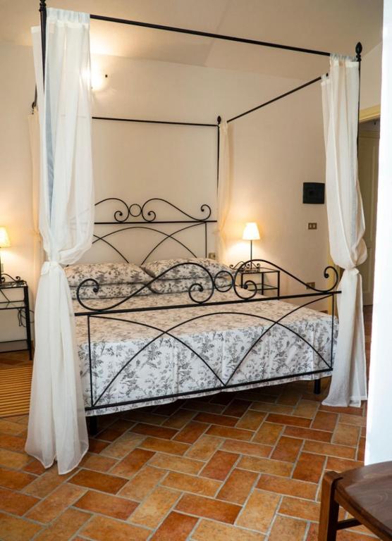 Postel nebo postele na pokoji v ubytování Agriturismo Podere Forano