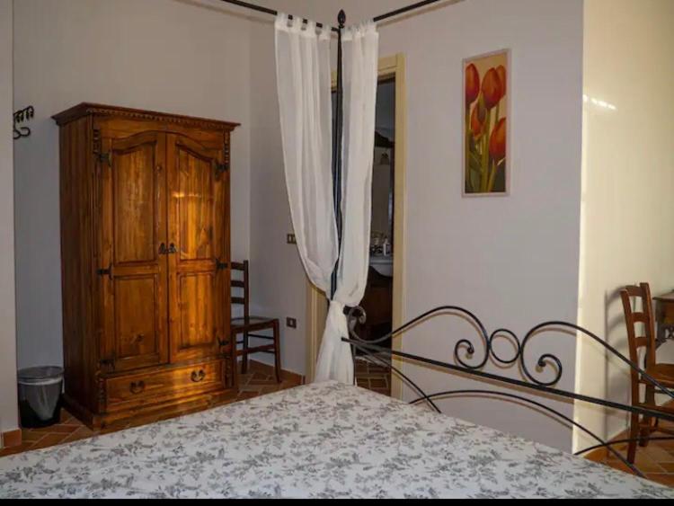 Postel nebo postele na pokoji v ubytování Agriturismo Podere Forano